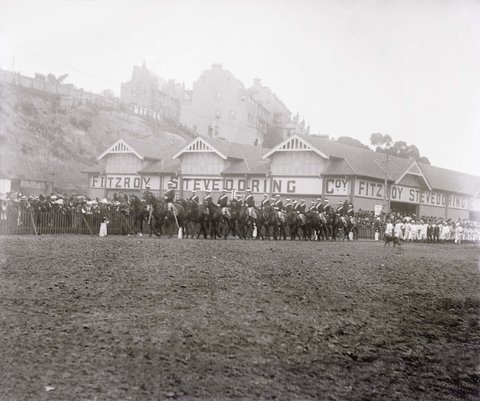 Troops preparing to depart for the Boer War at a parade passing the Fitzroy Stevedoring Company, Wooloomooloo (NSW), 1900