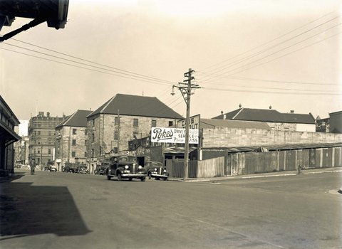 Street view showing the Commissariat Stores building, c. 1939
