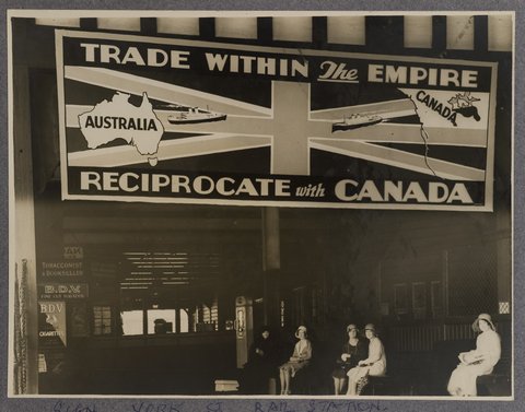 Advertising billboard at Wynyard Railway Station promoting trade between Australia and Canada, 1930 - 1939