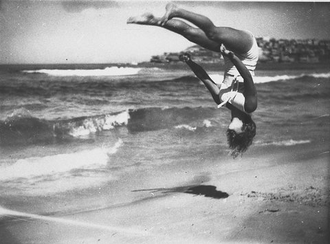 Peggy Bacon in mid-air backflip, Bondi Beach, Sydney, 1937