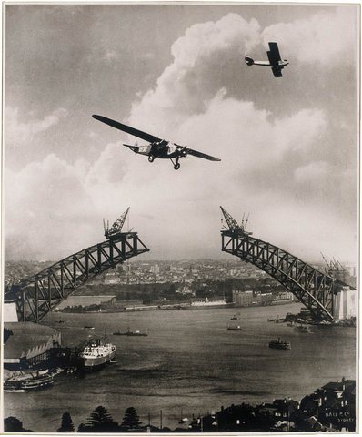 Sydney Harbour Bridge during construction, 1930, with two aeroplanes, Charles Ulms "Southern Sun" & a Gypsy Moth photomontage by Edward Searl