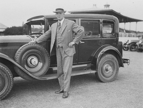 Believed to be former Federal Treasurer Ned Theodore beside his 1928 model Hudson sedan Ted Hood 2041988