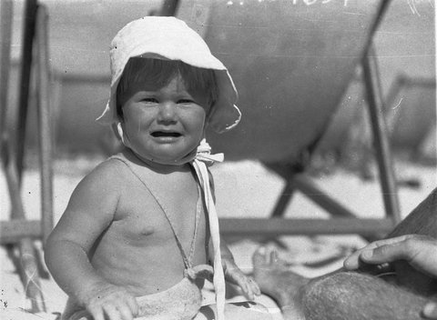 A baby girl on the sand Bondi Beach, c. 1932