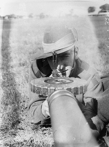 A cadet aiming a Lewis gun, 1930s