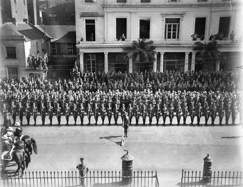 A CMF Infantry battalion presents arms in front of State Parliament, 1930s