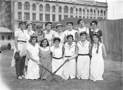 A group of 14 unidentified vigoro players Some have B W on their caps, c. 1929