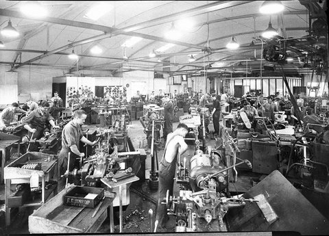 A large engineering works EG Bishop Pty Ltd Chippendale showing turret and other automatic lathes and turners machining parts for Lithgow Small Arms Factory, 1944