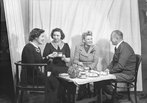 A movie set three women and a man take morning tea scene from These Children BritishAustralian production, 1944