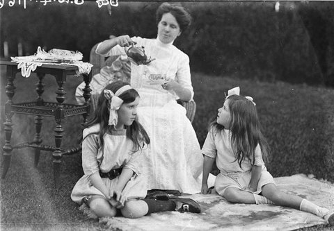 A study of young women in Old World costume with two small girls, 1930s