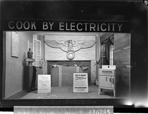 A Sydney County Council window display showing an electric stove and Cook by Electricity sign, 1941