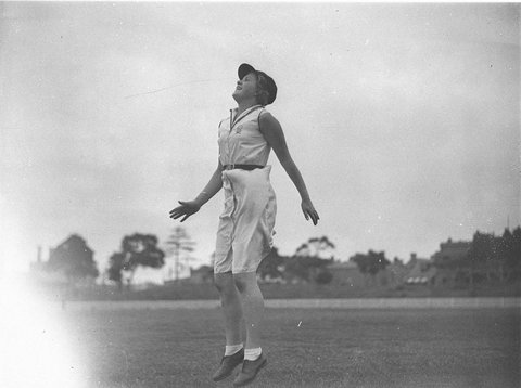 A vigoro player jumps for a catch on the outfield, c. 1929
