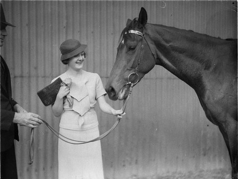 A woman owner with her winning horse, 1934