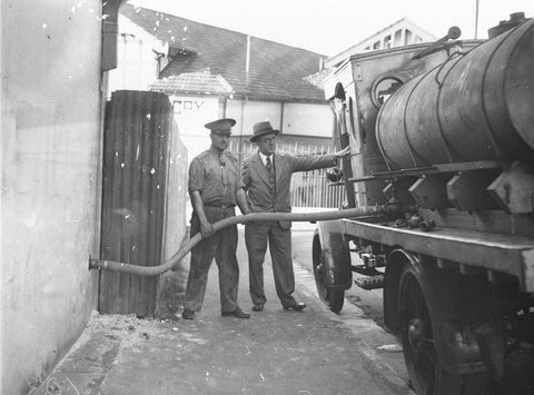 An early Shell refuelling tanker note solid rubber tyres, 1920s