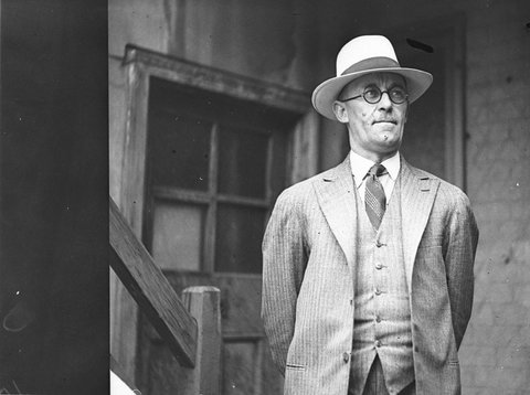 An unidentified man wearing hat and spectacles, c. 1929
