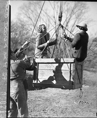 Army display Closeup of two women about to get in the boxlike flying fox, 1938