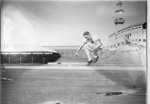 Athlete jumping Sydney Cricket Ground, c. 1930