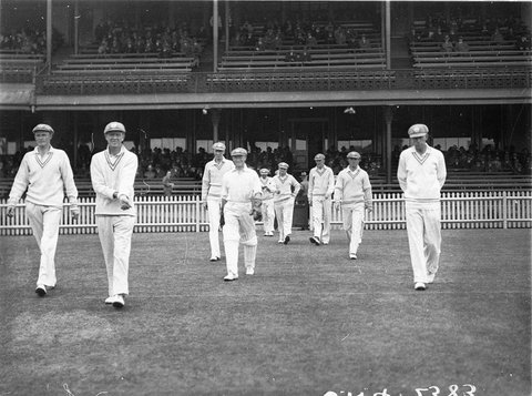 Australia takes the field Wicketkeeper Bert Oldfield with pads in middle, c. 1932