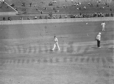 Burrows walking up to bowl, 1930s