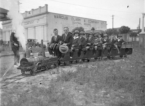 Buy Australian Made Campaign Fort Street schoolboys riding on a model steam train at the Australian Manufacturers Exhibition, 1927
