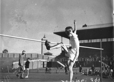 Clearing the bar at the high jump, 1930s