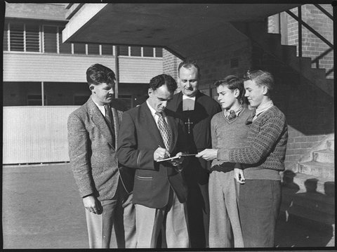 Clive Churchill captain of Rugby League Kangaroos at Marist Brothers Hamilton with principal Br Anselm, 1952