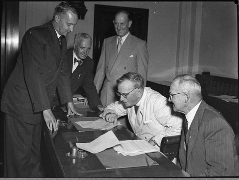 Cultural Centre special council meeting and members viewing model of memorial, 1955