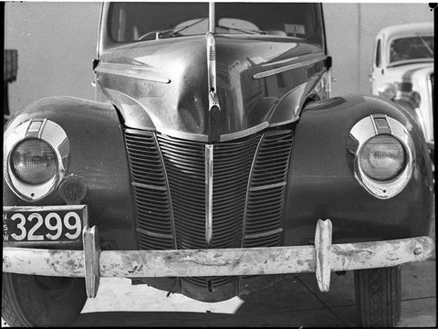 Damaged Ford Deluxe car reg no 3299 at Hastings Deering, 1946