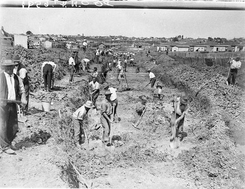 Depression years relief workers digging a stormwater canal, 1933