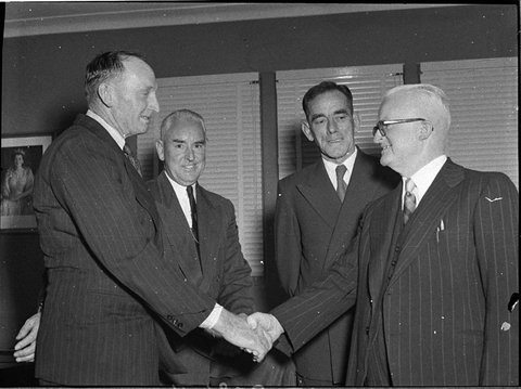 Deputy President Cr WL Quinn congratulates President Cr WL Quinn on his election Centre Cr W Wilson left Cr G Durie, 1955