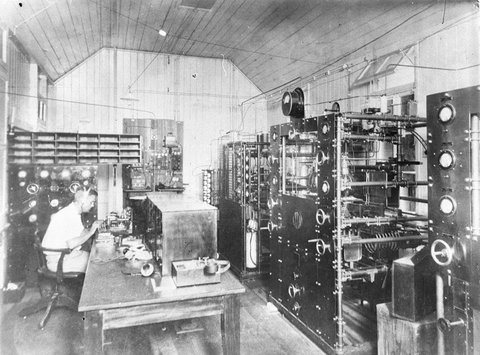 Engineer testing transmitter panels at AWA, 1930s