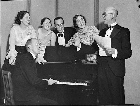 Entertainers around a piano, 1930s