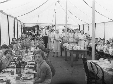 Far West children having their first meal at Manly in a marquee, 1934