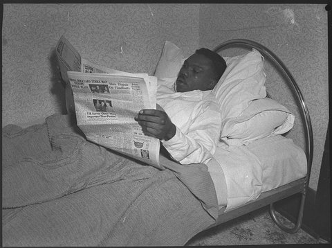 Freddie Dawson American boxer in bed, 1953