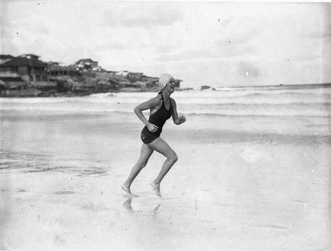 Girl running along the beach, c. 1934