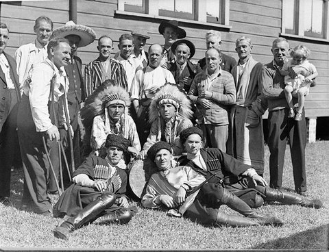 Group including men in Native American Mexican and Cossack costumes, 1930s