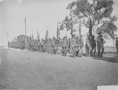 Infantry group marching off with their colours, c. 1934