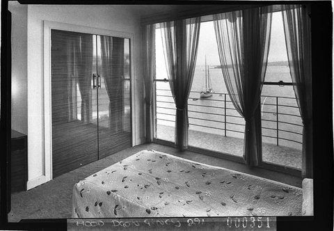 Interior showing bedroom with views of Elizabeth Bay Edgewater flats, 1937