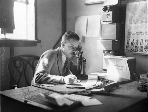 John Strange on the phone in his office, 1934
