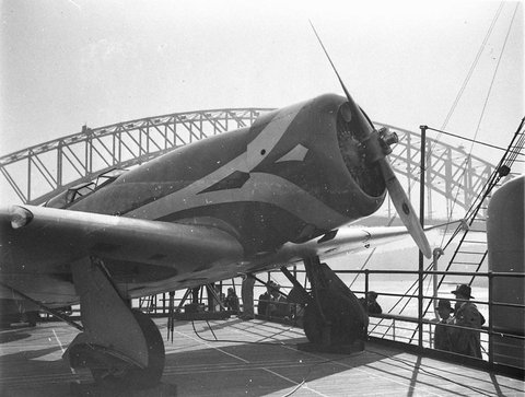 Lockheed Altair Anzac on the deck of the Mariposa with the Harbour Bridge in background, 1934