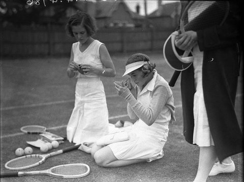 Miss E McColl left and Miss Nina Vickery repair damage to their makeup, c. 1934