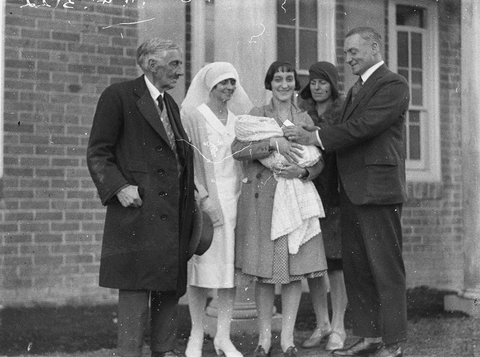 Mother and baby in group with nurses unidentified doctor and VIP, 1928–31