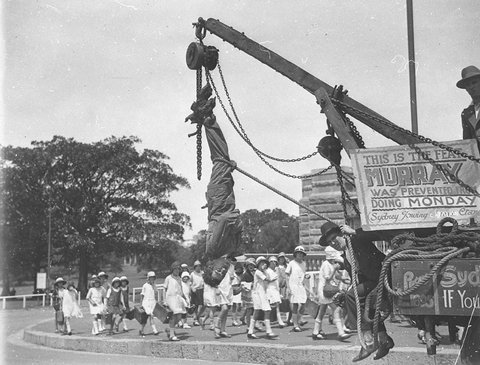 Murray the escapologist in a straightjacket, 1928