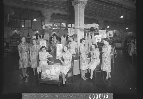 Nine salesgirls in front of Cesarine fabrics and SparvaSpun Lining, 1939