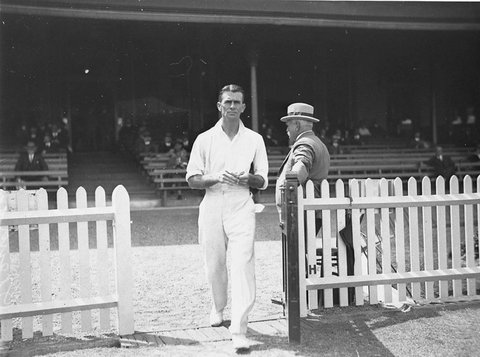 Oxenham walking on to the field, 1930s