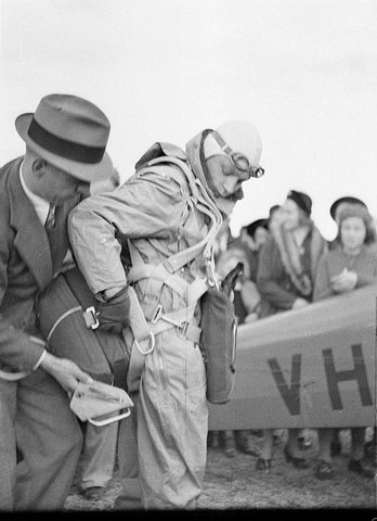 Parachutist Ben Turner jumping from plane at Camden, 1938