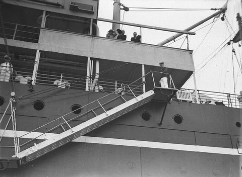 Passengers watch as the ships gangway is lowered, c. 1935