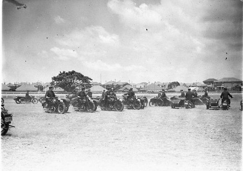 Police motorcycle combination in mass formation on Kensington Racecourse, 1930s