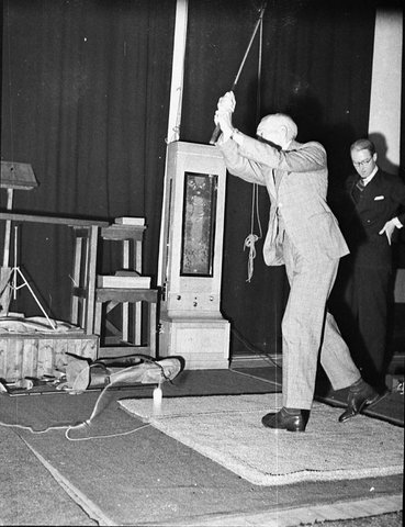 Politicians recording for Columbia Gramophone Co taken for Mingay Publishing Co sic ie Golf machine, 1937