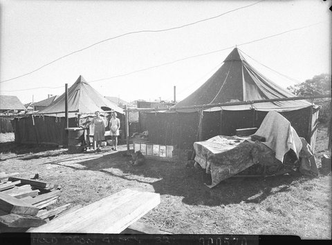 Poor families living under canvas at Lidcombe Auburn or Bankstown taken for Charles A Morgan MHR, 1946