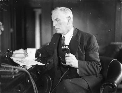Portrait of unidentified ALP MHR in his office, 1930s